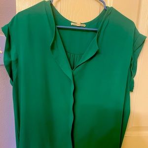 A beautiful lightweight green blouse size large